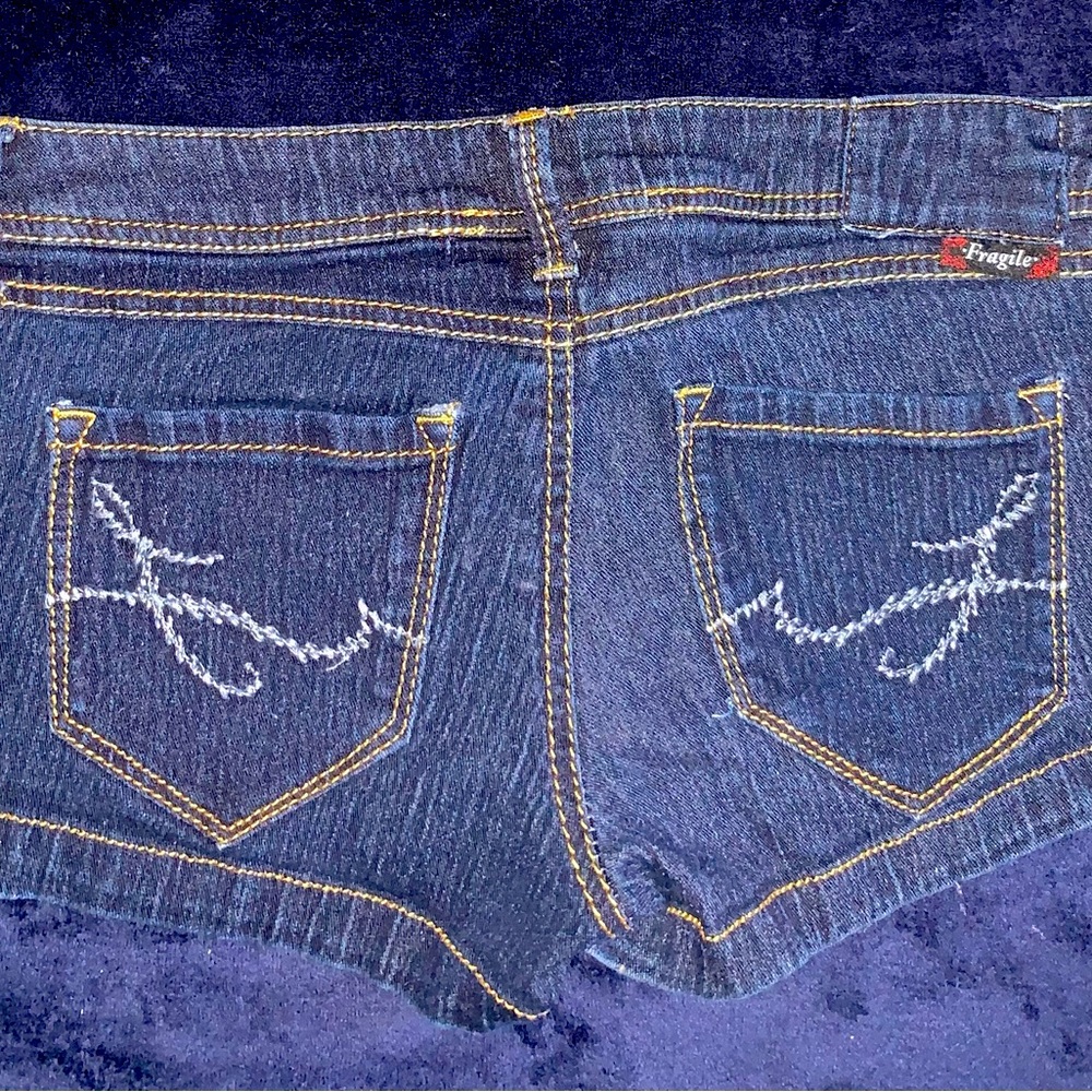 Fragile mini jean shorts